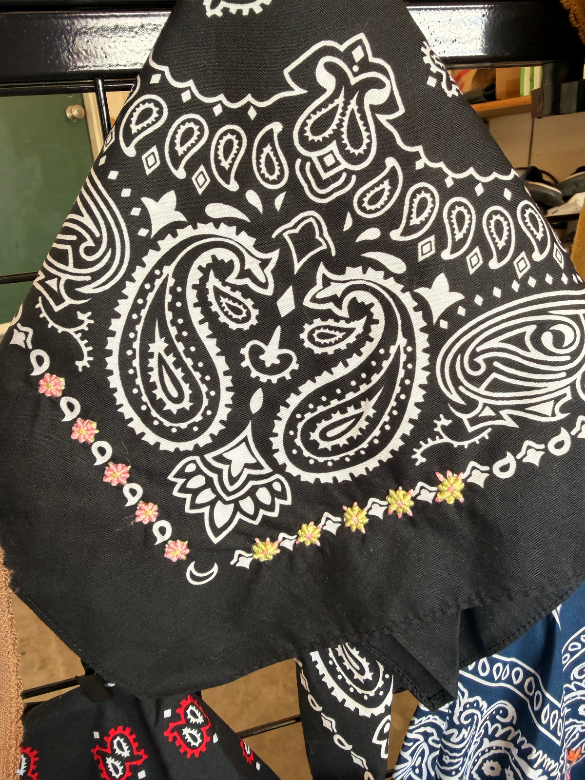 Black bandana with hand embroidered pink and yellow buttons