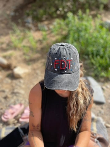 Person wearing FDT hat outdoors